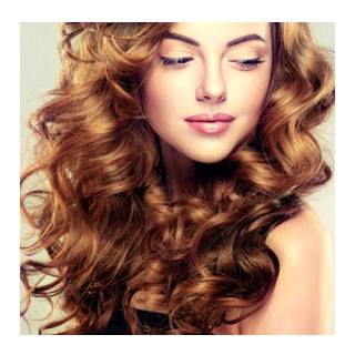 Woman with long curly auburn hair