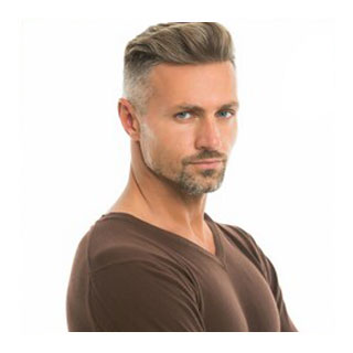 Man with grey hair and stubble