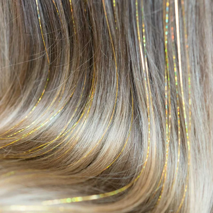 Gold tinsel in hair - perfect for festival hair